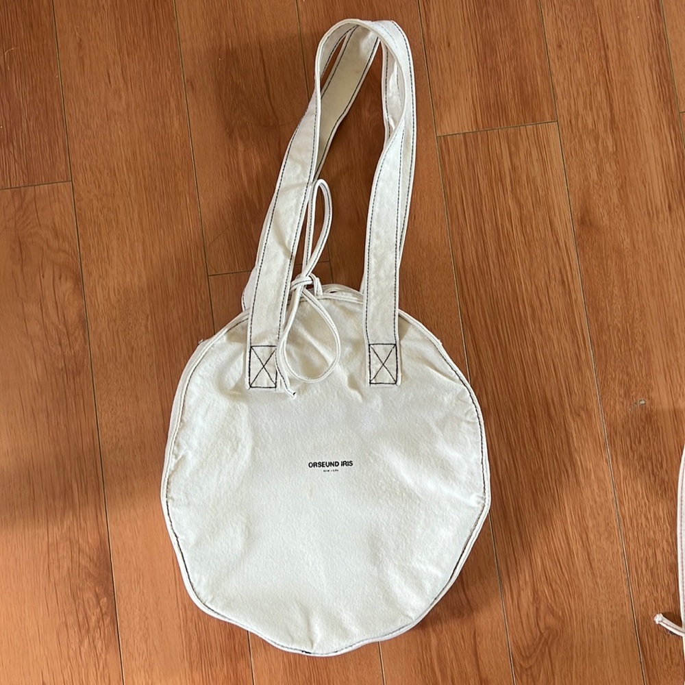 Orseund iris canvas circle tote bag - black stitch